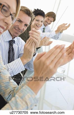 Business colleagues applauding in conference meeting View Large Photo Image Stock Photography - Business colleagues applauding in conference meeting. Fotosearch