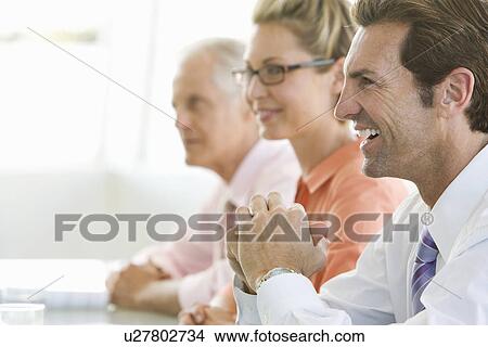 Business colleagues in conference meeting View Large Photo Image Picture - Business colleagues in conference meeting. Fotosearch