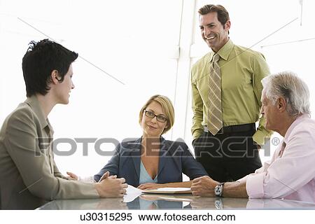 Business colleagues working in conference room View Large Photo Image Stock Photography - Business colleagues working in conference room. Fotosearch
