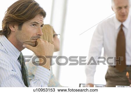 Stock Image - Business man in conference meeting. Fotosearch