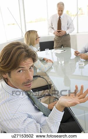 Business man in conference meeting View Large Photo Image Stock Image - Business man in conference meeting. Fotosearch