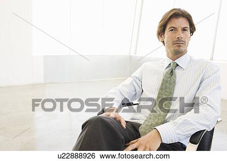 Business man sitting chair, portrait View Large Photo Image Stock Photograph - Business man sitting chair, portrait. Fotosearch