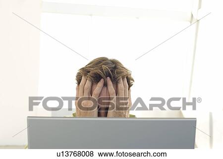 Business man using laptop in office View Large Photo Image Stock Photo - Business man using laptop in office. Fotosearch