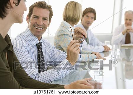 Stock Image - Business meeting in conference room. Fotosearch