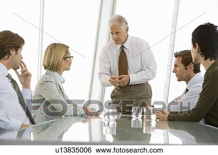 Business meeting in conference room View Large Photo Image Stock Photograph - Business meeting in conference room. Fotosearch