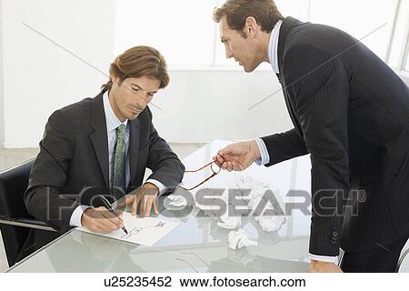 Business men working in conference room View Large Photo Image Stock Image - Business men working in conference room. Fotosearch