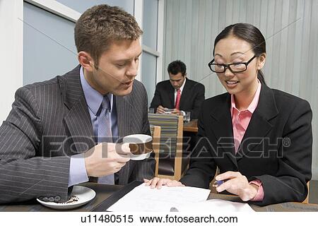 Business people having meeting and lunch View Large Photo Image Stock Photography - Business people having meeting and lunch. Fotosearch