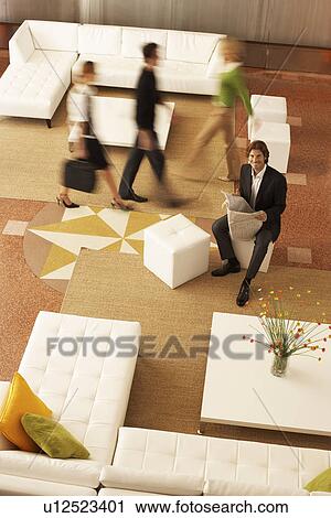 Business people in lobby, elevated view View Large Photo Image Stock Image - Business people in lobby, elevated view. Fotosearch