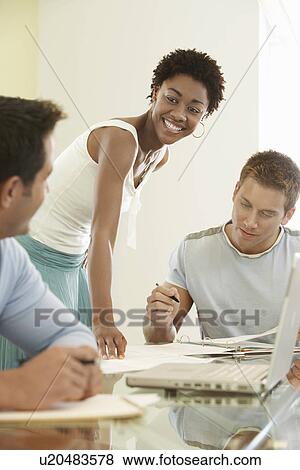 Business people in office meeting View Large Photo Image Stock Photo - Business people in office meeting. Fotosearch
