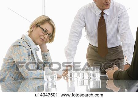 Stock Image - Business woman in conference meeting. Fotosearch