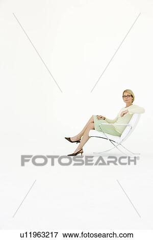 Business woman sitting in chair, portrait View Large Photo Image Stock Photo - Business woman sitting in chair, portrait. Fotosearch
