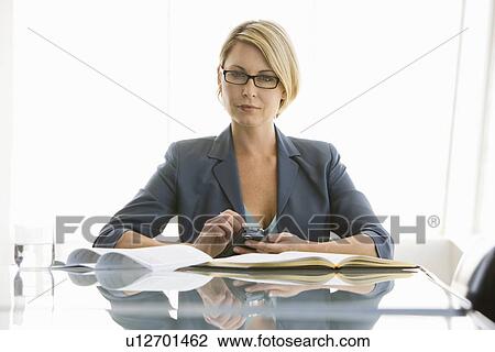 Business woman working in conference room, portrait View Large Photo Image Stock Image - Business woman working in conference room, portrait. Fotosearch