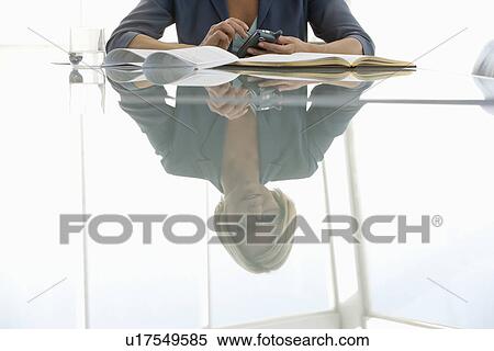 Stock Photography - Business woman working in conference room. Fotosearch