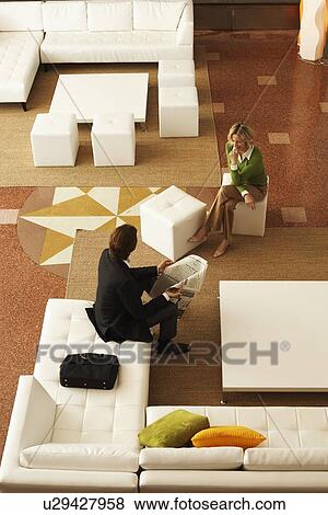 Businessman and Businesswoman in Office Lobby View Large Photo Image Stock Photo - Businessman and Businesswoman in Office Lobby. Fotosearch