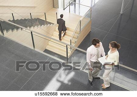 Businessman and Businesswoman on Office Balcony View Large Photo Image Stock Photo - Businessman and Businesswoman on Office Balcony. Fotosearch