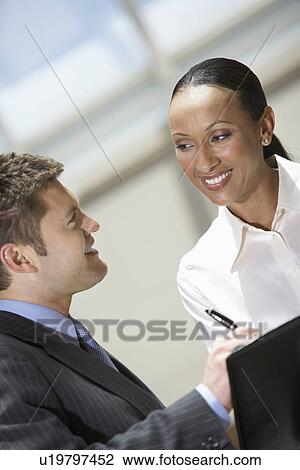 Businessman and Businesswoman signing contract, head and shoulders View Large Photo Image Stock Image - Businessman and Businesswoman signing contract, head and shoulders. Fotosearch