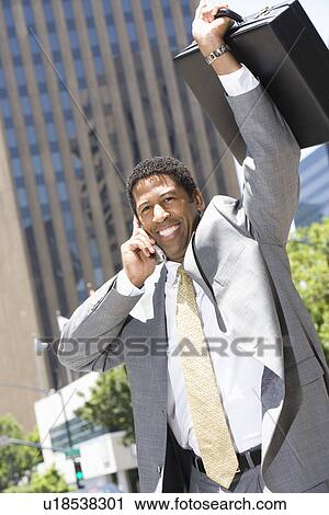 Businessman celebrating at street View Large Photo Image Stock Image - Businessman celebrating at street. Fotosearch