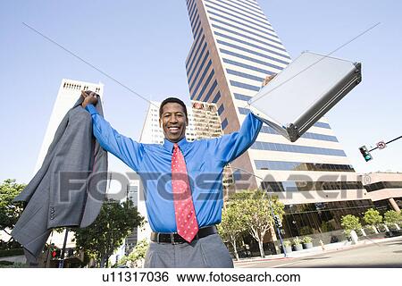 Businessman celebrating at street View Large Photo Image Stock Photograph - Businessman celebrating at street. Fotosearch