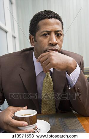 Businessman drinking coffee on business lunch View Large Photo Image Stock Image - Businessman drinking coffee on business lunch. Fotosearch