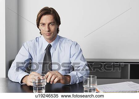 Businessman in office, portrait View Large Photo Image Stock Photography - Businessman in office, portrait. Fotosearch