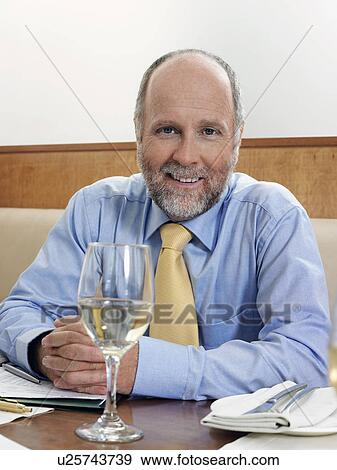 Businessman in restaurant, portrait View Large Photo Image Stock Photo - Businessman in restaurant, portrait. Fotosearch