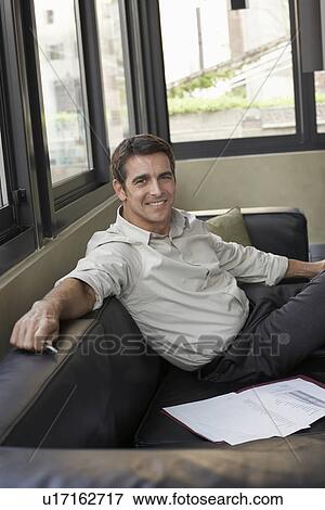 Businessman on Sofa View Large Photo Image Stock Photo - Businessman on Sofa. Fotosearch