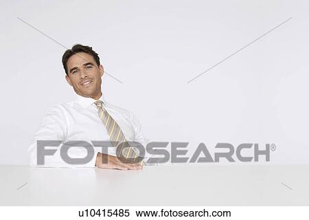 Businessman Sitting at White Table View Large Photo Image Stock Photography - Businessman Sitting at White Table. Fotosearch
