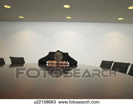 Businessman sleeping at table in conference room View Large Photo Image Stock Image - Businessman sleeping at table in conference room. Fotosearch