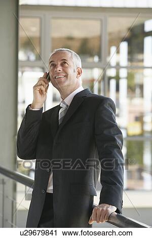 Businessman Using Cell Phone View Large Photo Image Stock Image - Businessman Using Cell Phone. Fotosearch