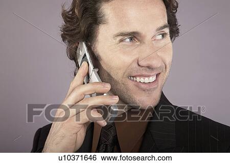 Businessman Using Cell Phone View Large Photo Image Stock Photograph - Businessman Using Cell Phone. Fotosearch