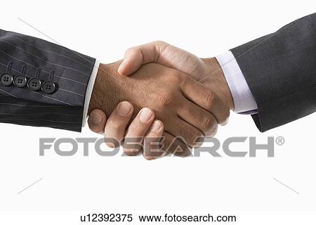 Businessmen Shaking Hands, close-up on hands View Large Photo Image Stock Photography - Businessmen Shaking Hands, close-up on hands. Fotosearch