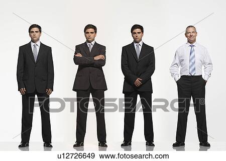 Businessmen standing side by side, arms crossed, by side, clasped, in pockets, digitally enhanced View Large Photo Image Stock Photo - Businessmen standing side by side, arms crossed, by side, clasped, in pockets, digitally enhanced. Fotosearch