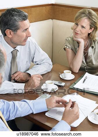 Businesspeople having meeting in restaurant View Large Photo Image Stock Photograph - Businesspeople having meeting in restaurant. Fotosearch