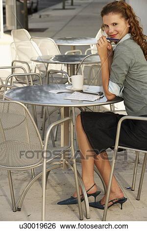 Stock Photograph - Businesswoman at Sidewalk Cafe. Fotosearch