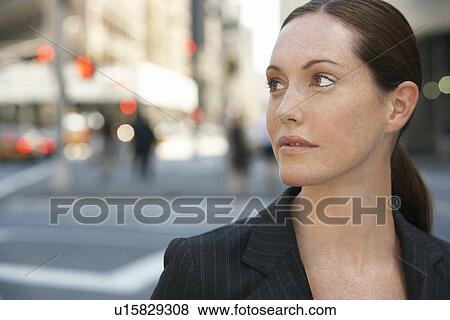 Businesswoman by intersection in street View Large Photo Image Stock Photo - Businesswoman by intersection in street. Fotosearch
