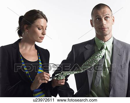 Businesswoman cleaning glasses on tie of businessman View Large Photo Image Stock Image - Businesswoman cleaning glasses on tie of businessman. Fotosearch