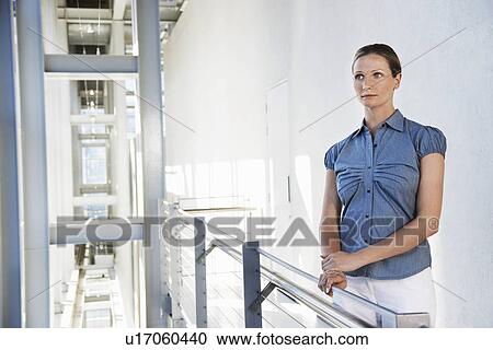 Businesswoman in modern building View Large Photo Image Stock Image - Businesswoman in modern building. Fotosearch