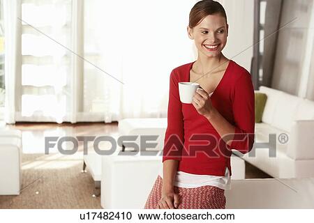 Stock Image - Businesswoman in Office Lobby. Fotosearch