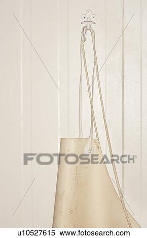 Stock Photography - Butcher's Apron Hanging on Wall. Fotosearch
