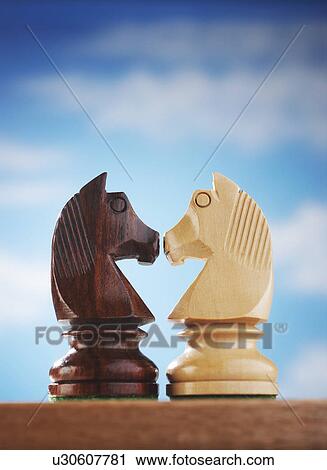 Chess pieces, two knights face to face View Large Photo Image Stock Image - Chess pieces, two knights face to face. Fotosearch