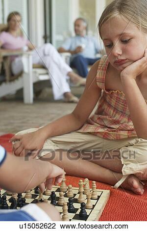 Stock Image - Children Playing Chess. Fotosearch