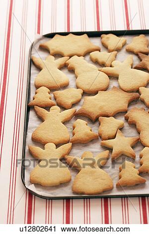 Stock Image - Christmas cookies on tray, view from above. Fotosearch