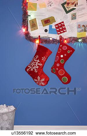 Christmas stocking decorations hanging on wall View Large Photo Image Stock Image - Christmas stocking decorations hanging on wall. Fotosearch