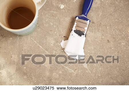 Coffee mug and paintbrush lying on floor, view from above View Large Photo Image Stock Photography - Coffee mug and paintbrush lying on floor, view from above. Fotosearch