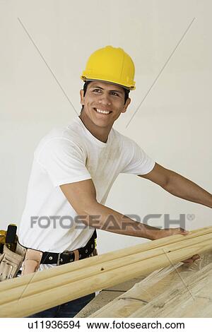 Picture - Construction worker in hard hat, smiling, portrait. Fotosearch