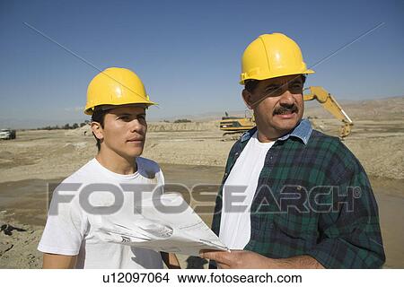 Construction Workers on construction site View Large Photo Image Picture - Construction Workers on construction site. Fotosearch