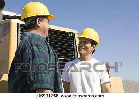 Construction Workers talking and smiling View Large Photo Image Stock Photo - Construction Workers talking and smiling. Fotosearch