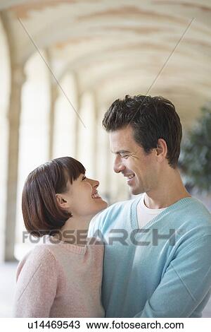 Couple embracing under archway, head and shoulders View Large Photo Image Stock Image - Couple embracing under archway, head and shoulders. Fotosearch