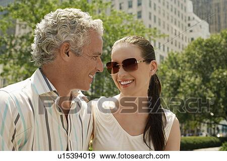Stock Photo - Couple face to face outdoors. Fotosearch