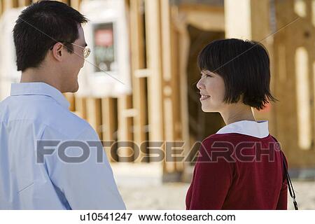 Stock Photo - Couple in construction site. Fotosearch